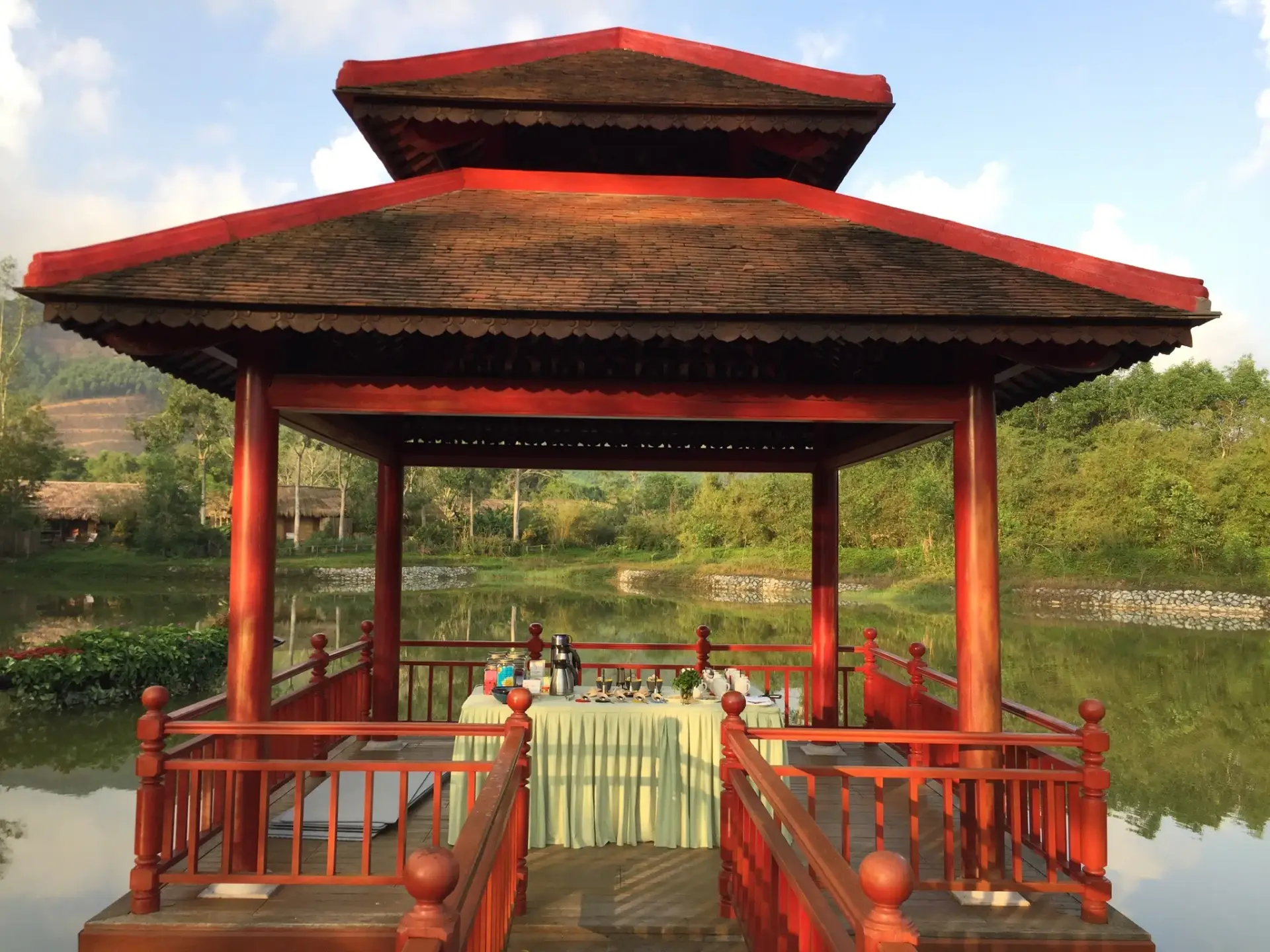 An open pavilion overlooking the Alba Wellness Valley Hue landscape during Yên Retreat