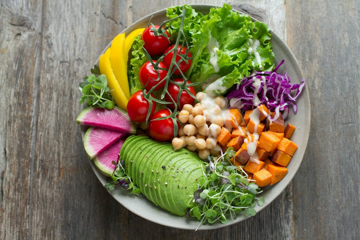 Fresh colorful vegetable salad bowl with leafy greens and vibrant vegetables